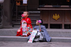 Shichi-Go-San, girl and boy with chitose-ame and a small toy