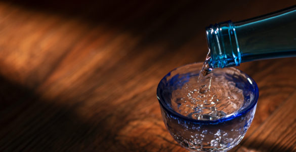 Pour sake into a transparent sake set