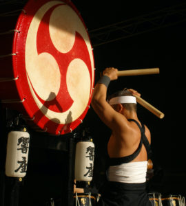 Traditional Japanese drummer with a large Japanese drum