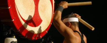 Traditional Japanese drummer with a large Japanese drum