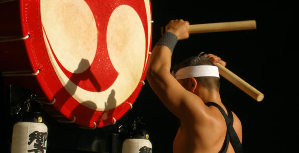 Traditional Japanese drummer with a large Japanese drum