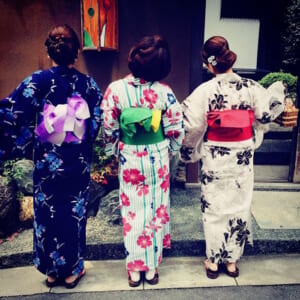 Three women in colorful Yukata (back view)